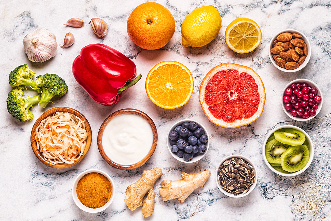 Healthy nutrient-rich foods including citrus fruits, yogurt, berries, nuts, and vegetables that support recovery after orthopedic procedures like MACI Regenerative Cartilage Therapy